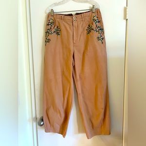 Baggy pants with embroidery detail